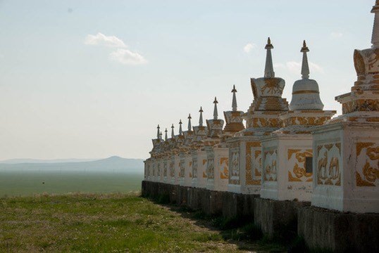 Whitewashed wall of Erdene Zuu with its row of stupas across the steppe.