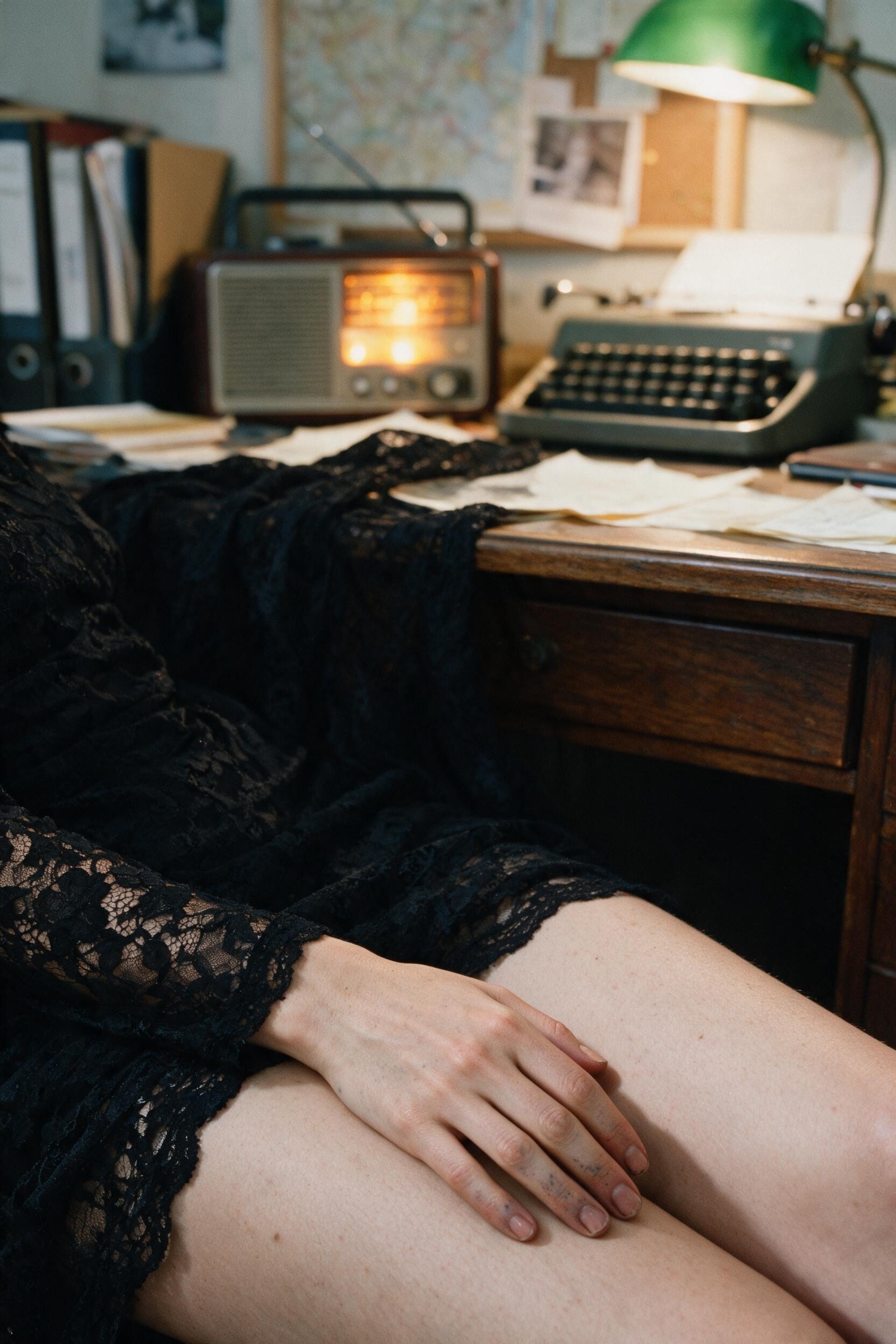 My ink-stained fingers resting on my thigh under the desk, the typewriter and radio keeping watch above.